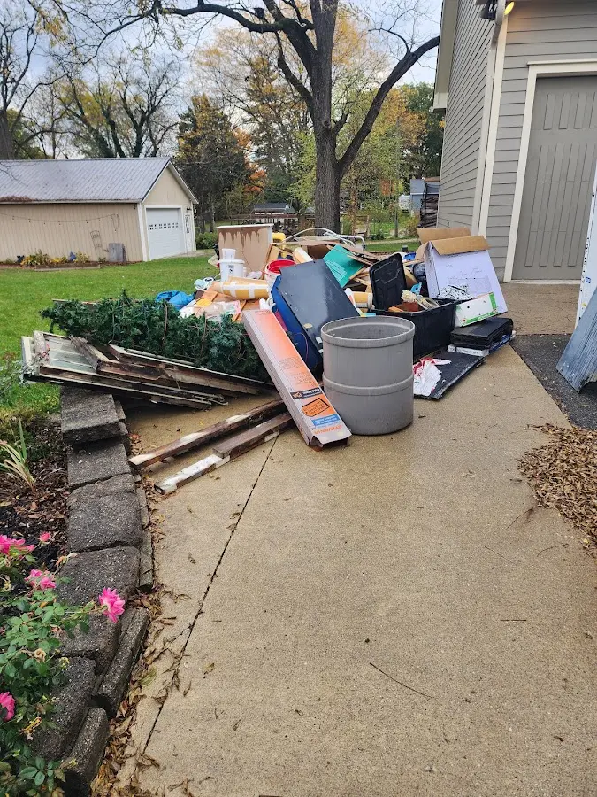 Dumpster being loaded with debris for Commercial Dumpster Rental in Sapulpa